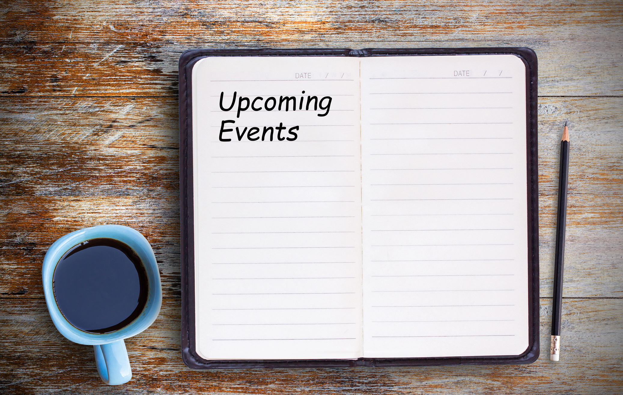 Text with Upcoming Events and Coffee Cup on Notebook